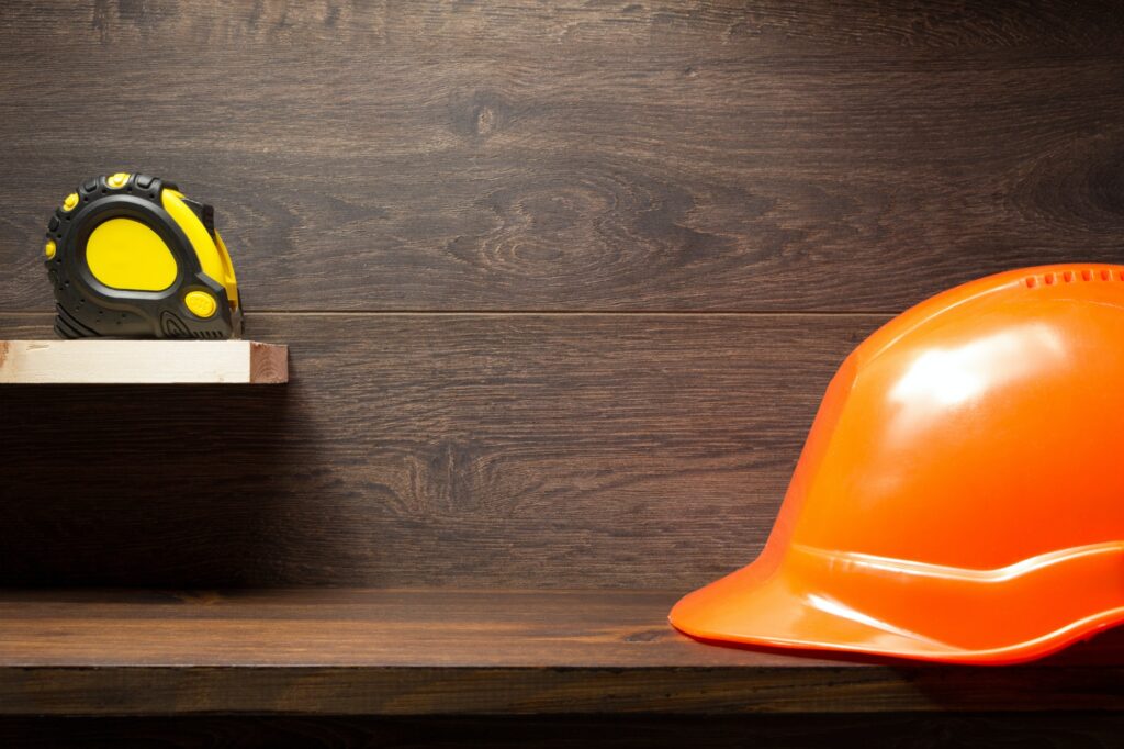 construction tools at wooden shelf